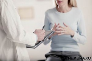 Doctor holding tablet PC talking to patient